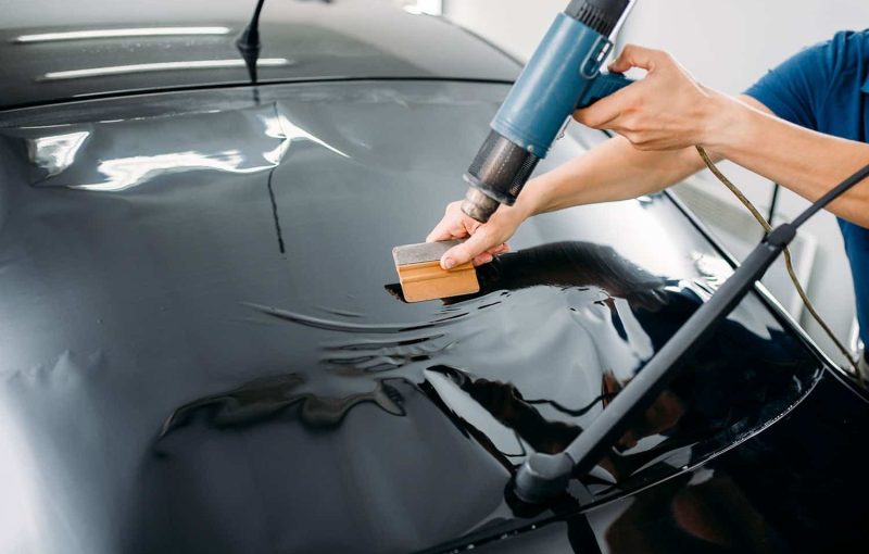specialist-with-drier-tinting-film-installation-2021-08-26-16-25-56-utc